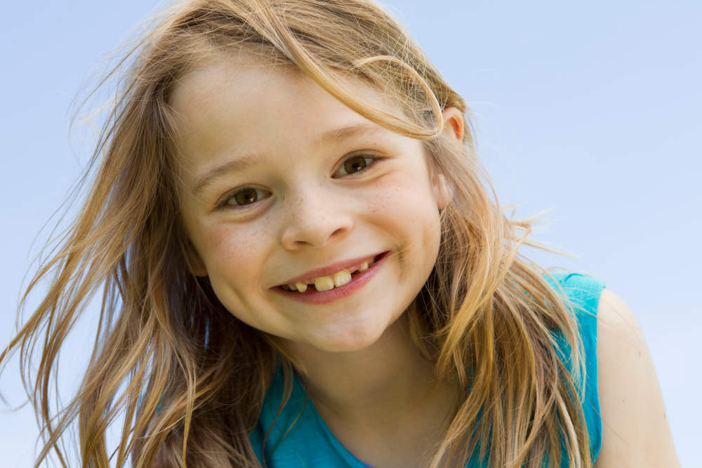 Close up of girls smiling face